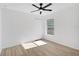 Bedroom showcasing wood-look floors, a ceiling fan, a window, and a closet for storage at 3722 Madbury Cir, Lakeland, FL 33810