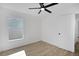 Light and airy bedroom features wood-look floors, a ceiling fan, a window, and closet at 3722 Madbury Cir, Lakeland, FL 33810