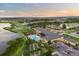 Aerial view of the community, showing the complex, pool, lakes, and golf course at 4068 Stone Creek Loop, Lake Wales, FL 33859