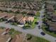 Aerial view of a home with a well-manicured lawn, located in a residential neighborhood at 4068 Stone Creek Loop, Lake Wales, FL 33859