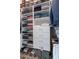 Walk-in closet with custom shelving and storage for shoes, clothing, and accessories at 4068 Stone Creek Loop, Lake Wales, FL 33859