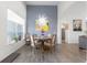 Bright dining room with tall ceilings, modern light fixture, and ample natural light at 4068 Stone Creek Loop, Lake Wales, FL 33859