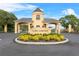 Lake Ashton's entrance features manicured landscaping and a distinctive gatehouse, showcasing community pride at 4068 Stone Creek Loop, Lake Wales, FL 33859