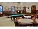 A game room with pool tables and card playing tables at 4068 Stone Creek Loop, Lake Wales, FL 33859