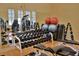 Well-equipped gym featuring a variety of free weights and machines for a complete fitness experience at 4068 Stone Creek Loop, Lake Wales, FL 33859