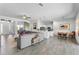 Bright open-concept living room flowing into the kitchen and dining areas with tile floors throughout at 4068 Stone Creek Loop, Lake Wales, FL 33859