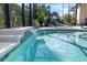 Enjoy the serene pool featuring a tranquil water feature and comfortable lounge chairs at 4068 Stone Creek Loop, Lake Wales, FL 33859