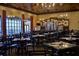 Spacious restaurant with tables, chairs, elegant chandeliers, and large windows at 4068 Stone Creek Loop, Lake Wales, FL 33859