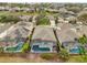 Aerial view of a home with a screened pool and lush backyard at 408 Orista Dr, Davenport, FL 33897