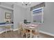 Charming dining area with a white table, chairs, and a window at 408 Orista Dr, Davenport, FL 33897