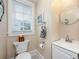 Powder room featuring toilet, small sink, mirror, and window at 415 W Rich Ave, Deland, FL 32720
