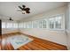 Bonus room with lots of windows, wood floors, and ceiling fans at 415 W Rich Ave, Deland, FL 32720