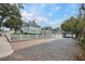 Long driveway leading to a charming home with a detached garage and covered parking at 415 W Rich Ave, Deland, FL 32720