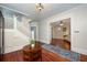 Elegant foyer featuring hardwood floors, a staircase, and an inviting view into the living room at 415 W Rich Ave, Deland, FL 32720