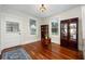 Bright living room boasts gleaming hardwood floors, large windows and period details at 415 W Rich Ave, Deland, FL 32720