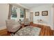 Cozy living room with two chairs, rug, and wood floors at 415 W Rich Ave, Deland, FL 32720