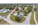 An aerial view presents an overview of the home, its setting, and position on the street corner at 4431 Clubhouse Rd, Lakeland, FL 33812