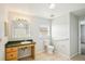 Neutral bathroom featuring a vanity with a green countertop, window, toilet, and tiled flooring at 4431 Clubhouse Rd, Lakeland, FL 33812