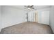 Neutral bedroom featuring a ceiling fan, carpet and three doors or closets at 4431 Clubhouse Rd, Lakeland, FL 33812