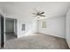 Neutral bedroom featuring a ceiling fan, carpet and a window with natural light at 4431 Clubhouse Rd, Lakeland, FL 33812