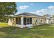 Charming single-story home featuring a screened in porch and well-maintained lawn at 4431 Clubhouse Rd, Lakeland, FL 33812