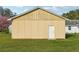 View of home exterior and separate garage at 4431 Clubhouse Rd, Lakeland, FL 33812