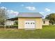 A detached garage with carport sits on a large lot at 4431 Clubhouse Rd, Lakeland, FL 33812