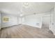 Bright living room with modern flooring, ample natural light, and a ceiling fan at 4431 Clubhouse Rd, Lakeland, FL 33812