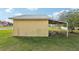 A view of the side and rear of a storage outbuilding with carport at 4431 Clubhouse Rd, Lakeland, FL 33812