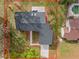 Aerial view of a home with a new roof, neatly landscaped yard, and an inviting pool at 4940 Spring Run Ave, Orlando, FL 32819