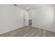 Bright bedroom featuring stylish light wood flooring, neutral walls and a doorway to the upper level at 4940 Spring Run Ave, Orlando, FL 32819