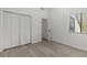 A well lit room with a closet, light streaming through the window, and light wood flooring at 4940 Spring Run Ave, Orlando, FL 32819