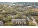 Overhead view of complex displaying a swimming pool, lush landscaping, parking, and nearby community features at 5255 Images Cir # 305, Kissimmee, FL 34746