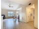 Open dining area with tile flooring, ceiling fan, and a glass-top table set, filled with natural light at 5255 Images Cir # 305, Kissimmee, FL 34746