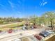 View of the parking lot surrounded by trees and well-maintained landscaping at 5255 Images Cir # 305, Kissimmee, FL 34746