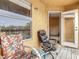 Balcony with chairs and a view of the building and trees at 5255 Images Cir # 305, Kissimmee, FL 34746