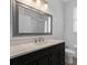 Well-appointed bathroom featuring a sleek vanity, framed mirror, and a shower-tub combination at 584 Brantley Terrace Way # 209, Altamonte Springs, FL 32714