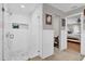 Modern bathroom featuring a glass-enclosed shower with tile surround and niche at 7545 Lake Dr, Belle Isle, FL 32809