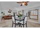 Dining area features a round table and opens to the living area and kitchen at 7545 Lake Dr, Belle Isle, FL 32809