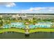 Picturesque aerial of the pool and resort highlighting the outdoor amenities near the lake at 8146 Coconut Pl, Kissimmee, FL 34747