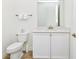 Clean and bright bathroom with a modern vanity, ample cabinet space, and a toilet at 8146 Coconut Pl, Kissimmee, FL 34747