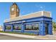 Eye-catching blue building with large windows and Yeoman's Cask & Lion signage against a blue sky at 8146 Coconut Pl, Kissimmee, FL 34747