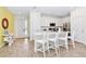 Bright, modern kitchen featuring white cabinetry, stainless steel appliances, and an island with seating at 8146 Coconut Pl, Kissimmee, FL 34747