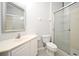 Traditional bathroom featuring a vanity with storage, toilet, and glass-enclosed shower at 8775 Sartori St # 208, Orlando, FL 32829