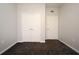 Empty bedroom with grey walls, carpet flooring and double door closet at 8775 Sartori St # 208, Orlando, FL 32829