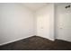 Empty bedroom with grey walls, carpet flooring and double door closet at 8775 Sartori St # 208, Orlando, FL 32829