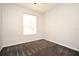 Unfurnished bedroom with soft gray walls and carpeted flooring at 8775 Sartori St # 208, Orlando, FL 32829