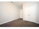 Empty bedroom with grey walls, carpet flooring and double door closet at 8775 Sartori St # 208, Orlando, FL 32829