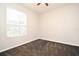 Bedroom with neutral paint, carpet, and a window at 8775 Sartori St # 208, Orlando, FL 32829