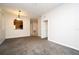 Large living area showcasing the open floor plan and arched doorway features at 8775 Sartori St # 208, Orlando, FL 32829